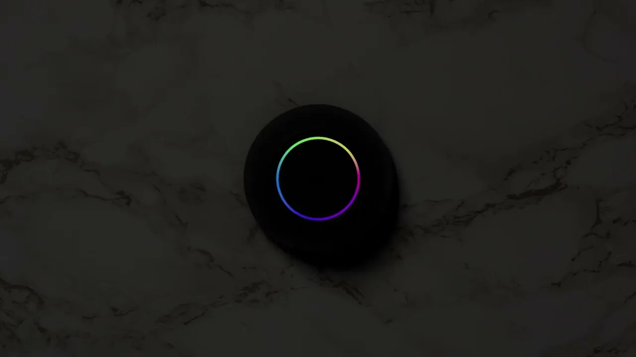 Josh Micro on a marble counter, its light ring responding to a voice request