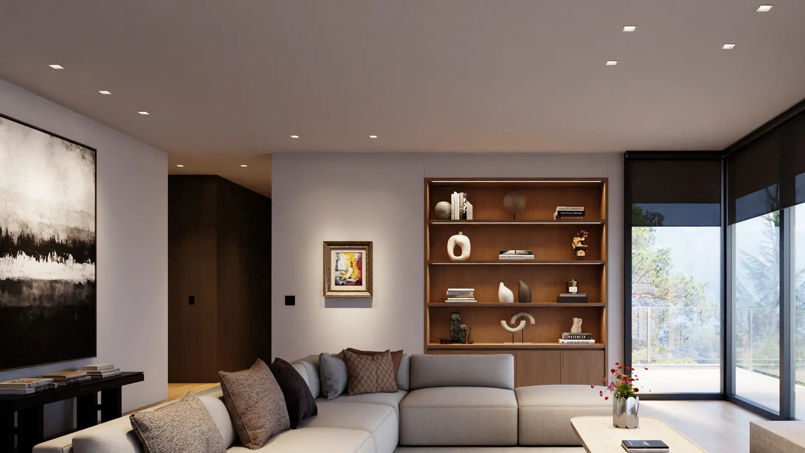 A living room with built-in shelving lit evenly by Rania downlights